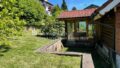 Gartenansicht mit Wintergarten